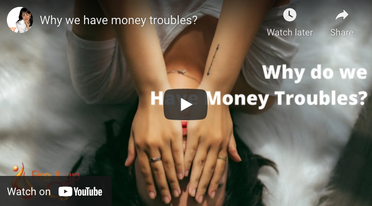 Adult laying down with hands over their face and the words "Why do we Have Money Troubles?"