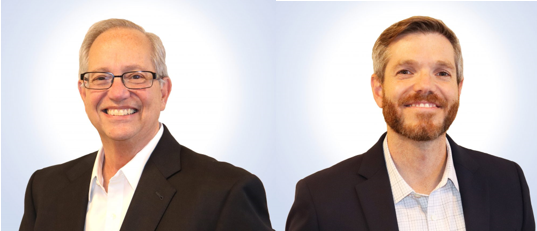 Frank and Frankie Corrado, both looking directly forward, wearing black suit jackets with white collared shirts