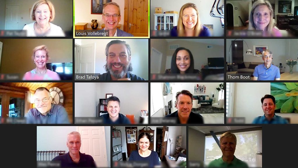 Screenshot photo of online video call showing all attendees looking forward and smiling.