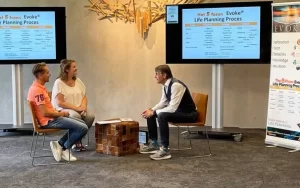 Three adults sitting, facing each other.